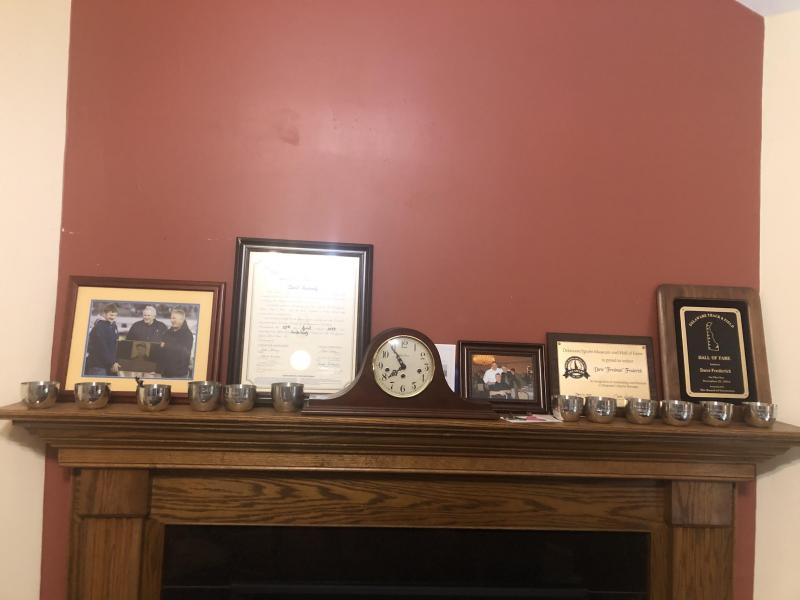 There are 12 state championship Jefferson Cups sitting on the Fredman mantel.